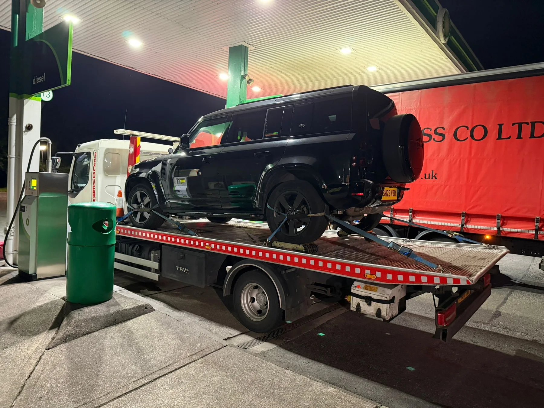 Lifesaver Vehicle Recovery truck at a fuel station during a night call-out