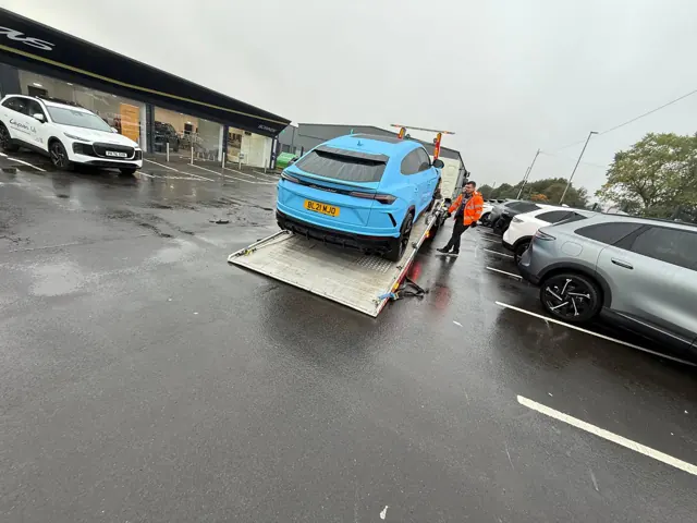 Lamborghini secured on a recovery truck