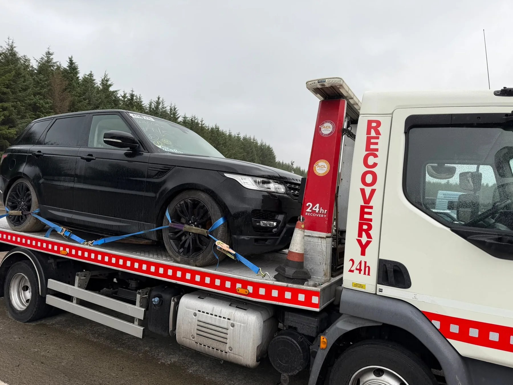 Range Rover secured on Lifesaver Vehicle Recovery tilt-and-slide truck in Glasgow