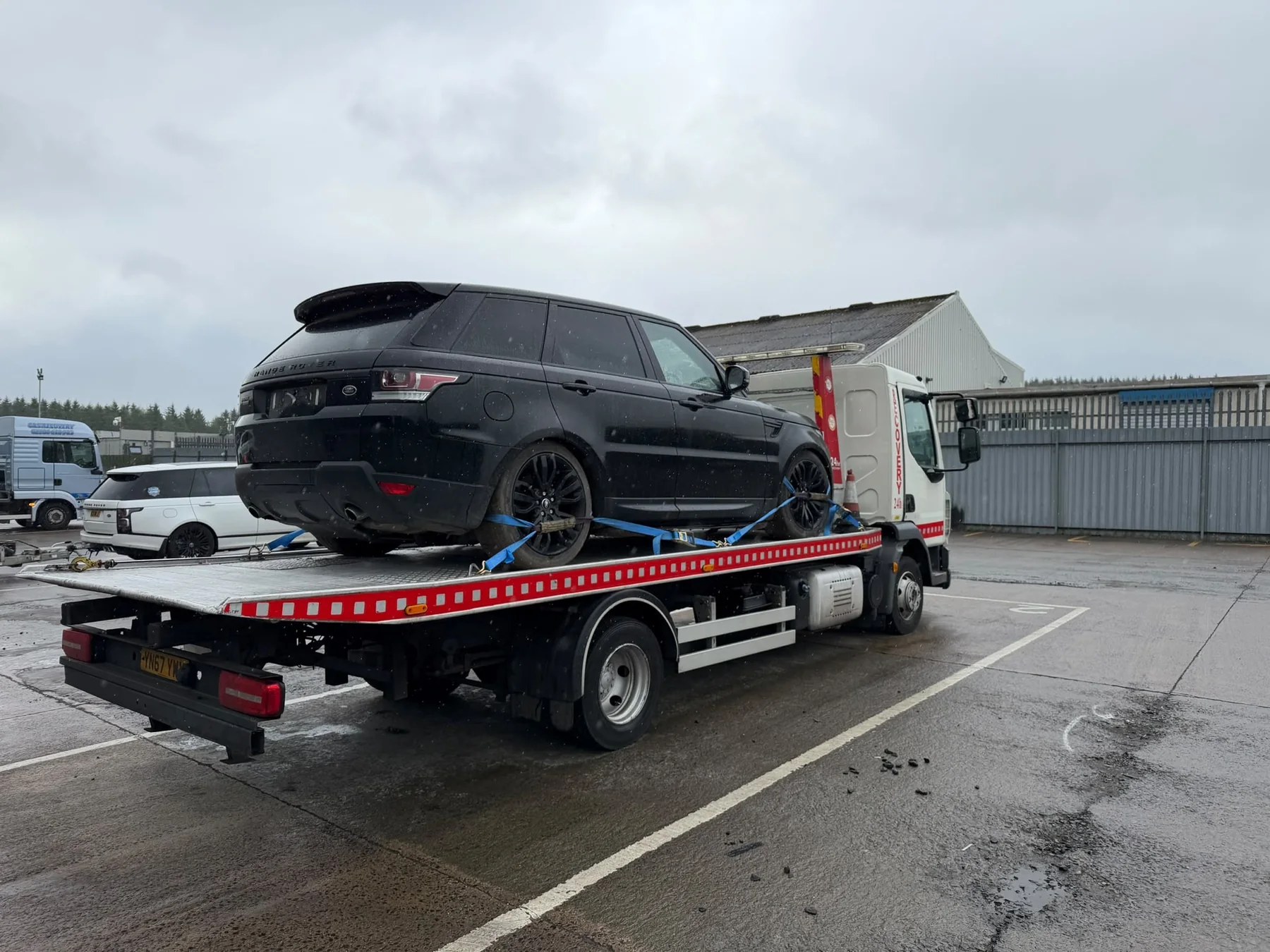 Range Rover on Lifesaver Vehicle Recovery tilt-and-slide truck