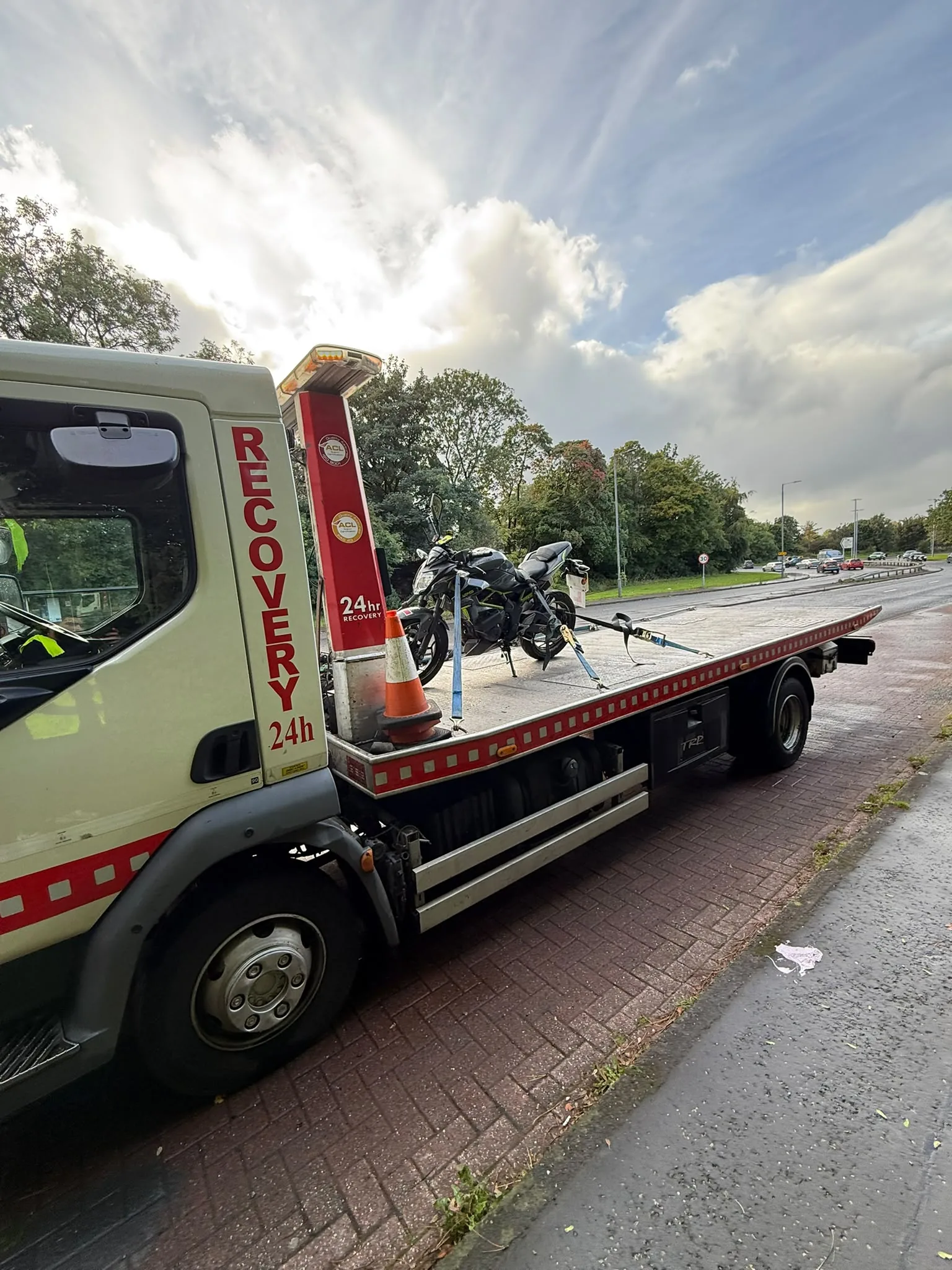 Motorcycle secured on Lifesaver flatbed recovery truck in Glasgow