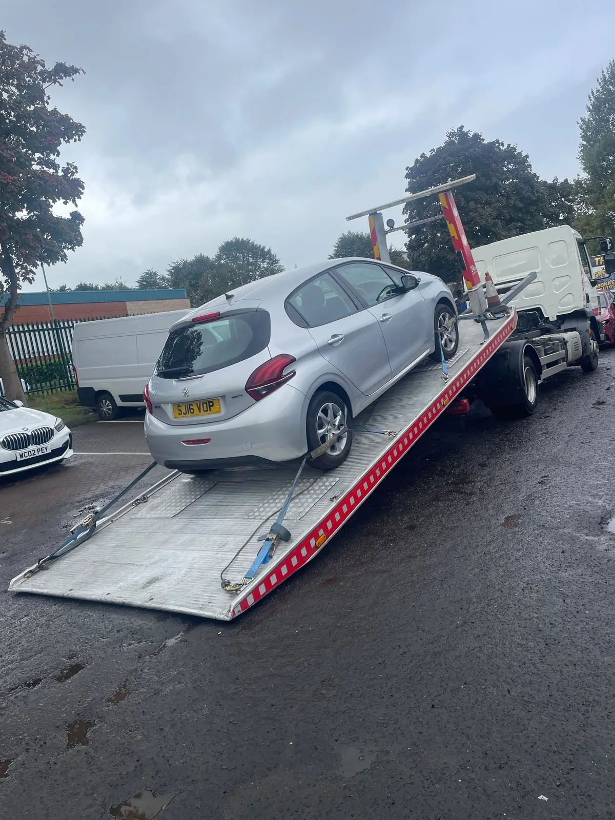 Silver Peugeot delivered by Lifesaver Vehicle Recovery to The Grease Monkey Autos Clydebank